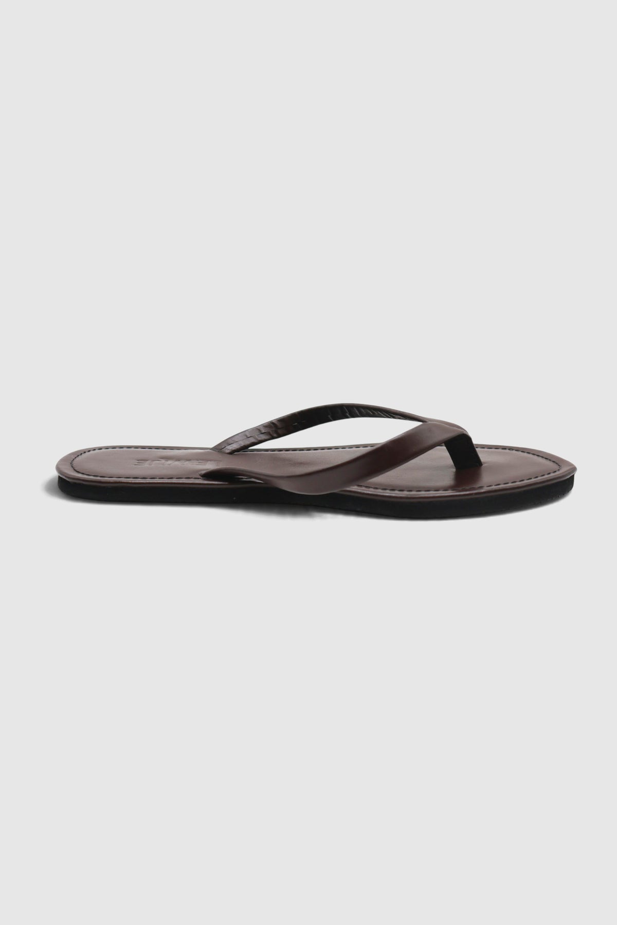 LEWIJE Mirissa flip flop in espresso brown, side profile showing the slim thong strap and black sole