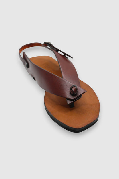 LEWIJE Serendib in brown, single sandal in three-quarter view showing the crossover strap, toe loop and buckled slingback