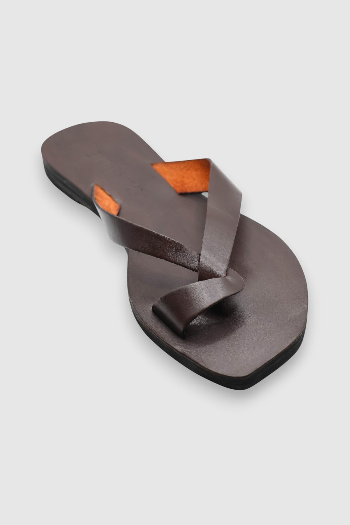 LEWIJE Unawatuna leather flip flop in espresso brown, single flip flop from above showing the toe ring and orange underside of the straps